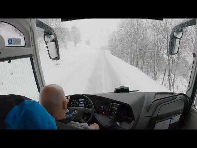 Bus drive in the Alps, snow season,  4K