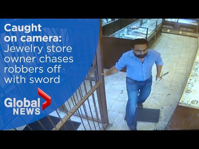 Jewelry store owner chases robbery suspects off with sword