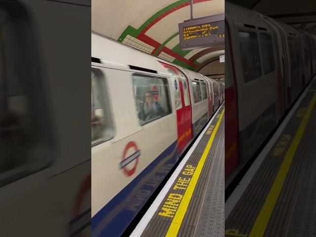 London Underground Bakerloo Line train arrives at Piccadilly Circus