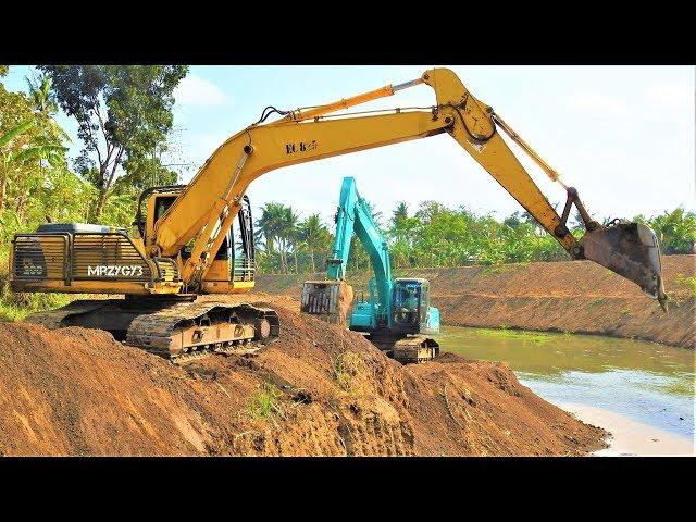 Excavators Excavating Dirt Kobelco SK200 Komatsu PC200 XCMG XE215C