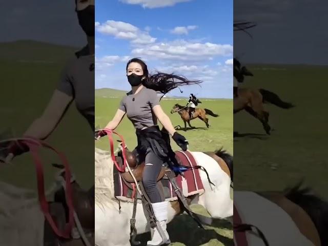 Buryat girls on horseback. Shenekhen, Hulunbuir, China.