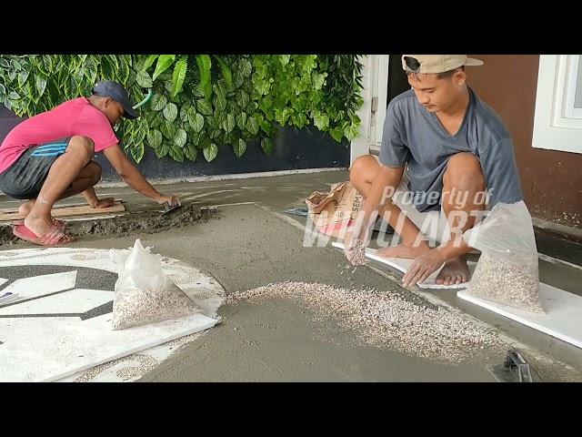 Proses pemasangan batu sikat - batu sikat untuk lantai garasi rumah 