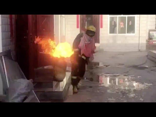 Heroic fireman risks life to drag burning gas cylinder out of house