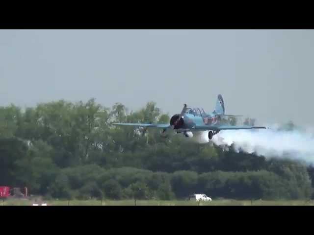 Lowpass with smoke on PH-DTM Yakovlev Yak-52 at Teuge Airport