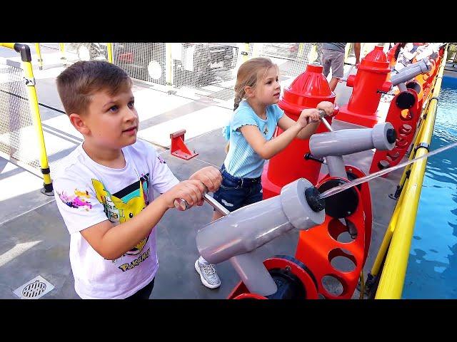 Diana and Roma interact with fun exhibits at the Legoland