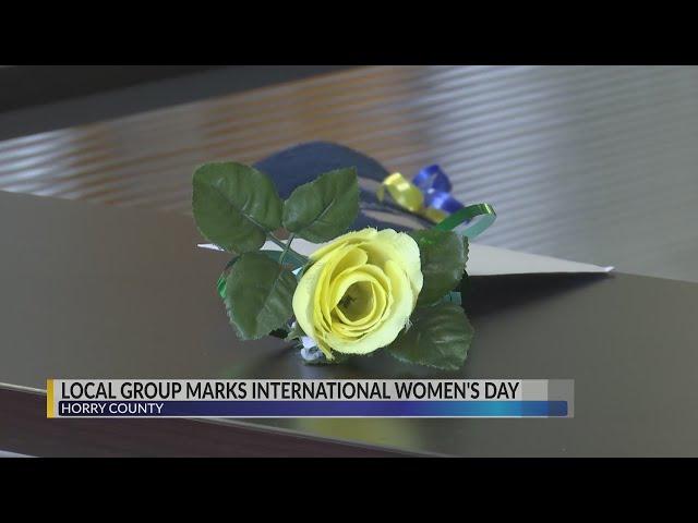 "Zonta MB" group gives yellow roses to women in leadership roles in the Grand Strand