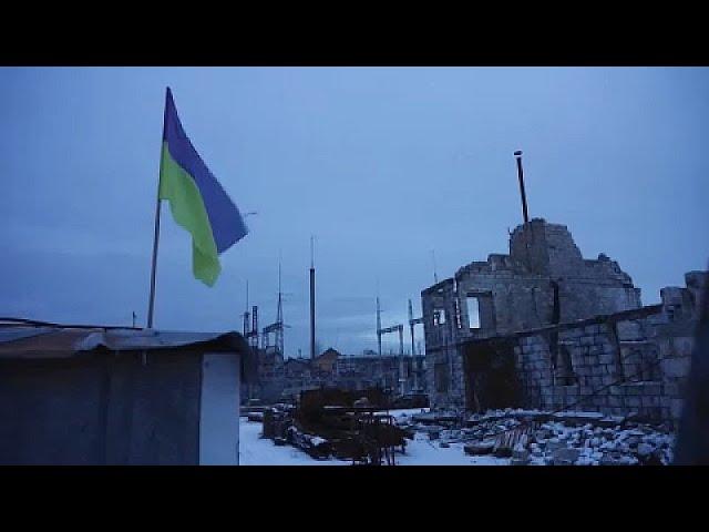 Young Ukrainians rebuild destroyed homes in the village of Horenka