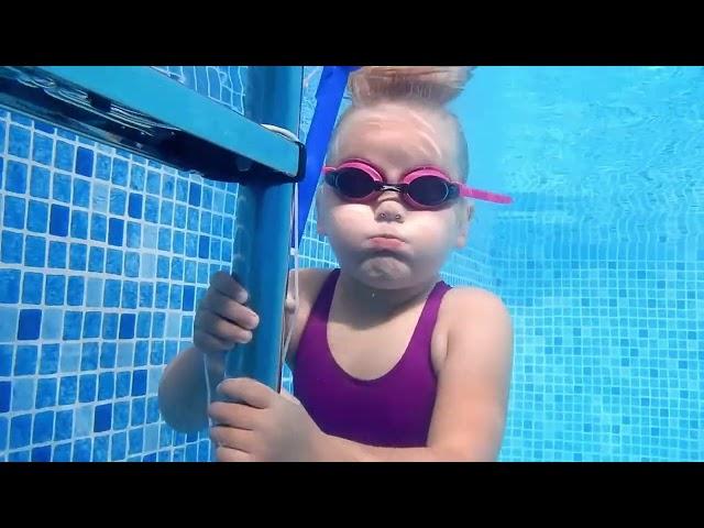 A Little Girl Hold Her Breath Underwater She Has Cute Cheeks Too
