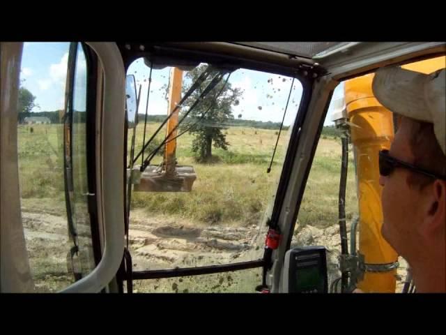 Long Reach Excavator Loading Mud