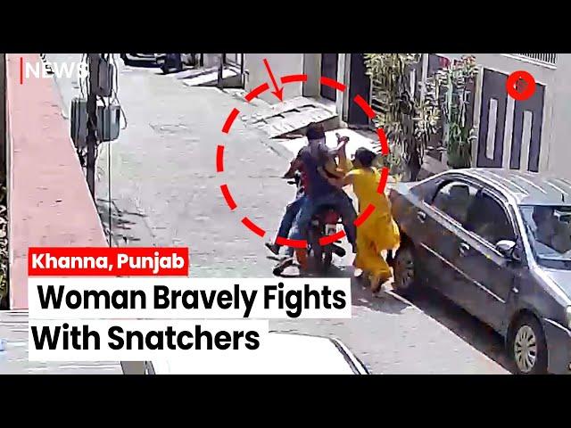 Woman Bravely Fights With Snatchers, Incident Caught On CCTV Camera