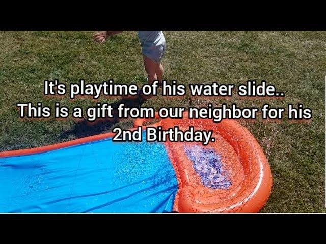 Summer is here..It's his water slide playtime.This is a gift from our neighbor for his 2nd Birthday.