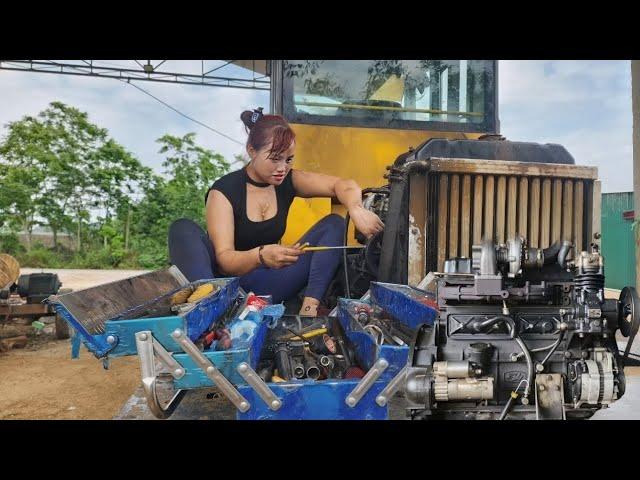 Genius girl modifies the engine of an excavator.