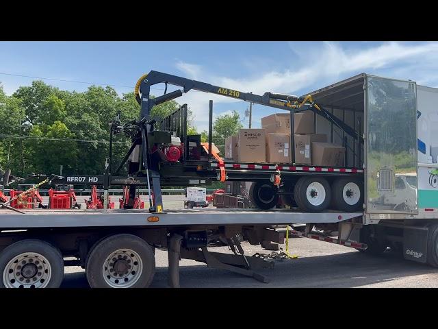 Rollback unloading a Log Loader trailer