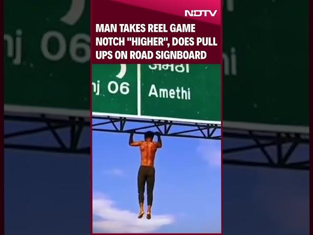 Man Takes Reel Game Notch "Higher", Does Pull Ups On Road Signboard