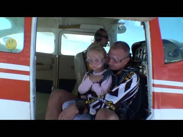 Dad skydiving with 5 years old daughter