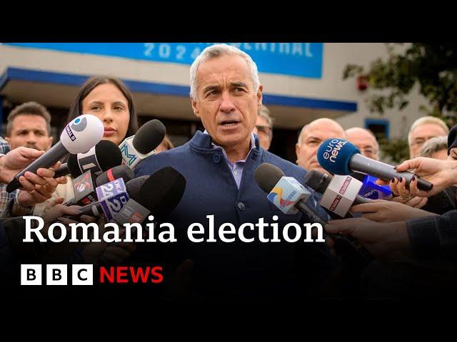 Far-right candidate takes shock lead in Romania presidential election | BBC News