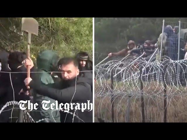 Migrants break down Belarus-Poland border fencing