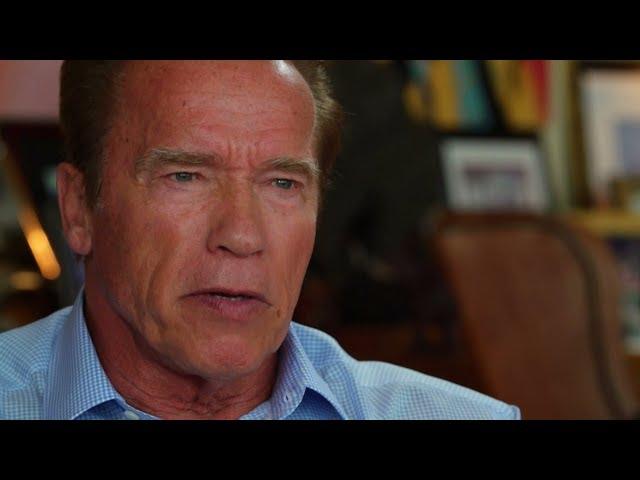 Arnold Schwarzenegger speaks with Guenther Ziesel