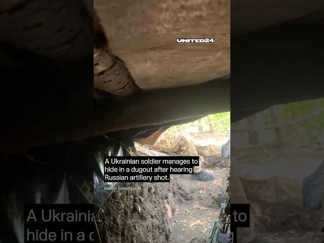 A Ukrainian soldier manages to hide in a dugout after hearing Russian artillery shot #warinukraine