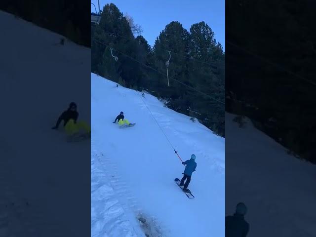 Snowboard beginner on the ski lift takes out everyone