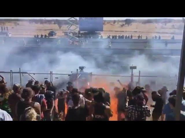 Crowds sprayed with burning fuel at a drag racing event