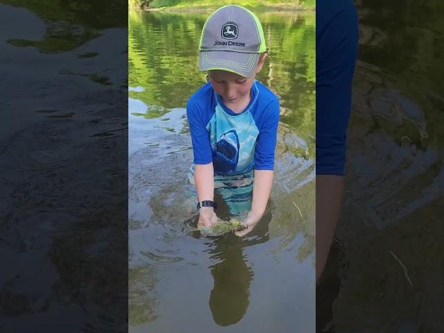 releasing his catch. #homesteaders #youngfarmer #fishing #youngfisher