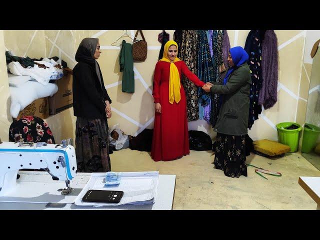 Sewing beautiful clothes for a nomadic girl by Fatima, an artist