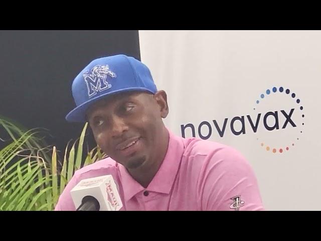 Memphis coach Penny Hardaway and players Tyrese Hunter and Colby Rogers after Tigers upset UConn