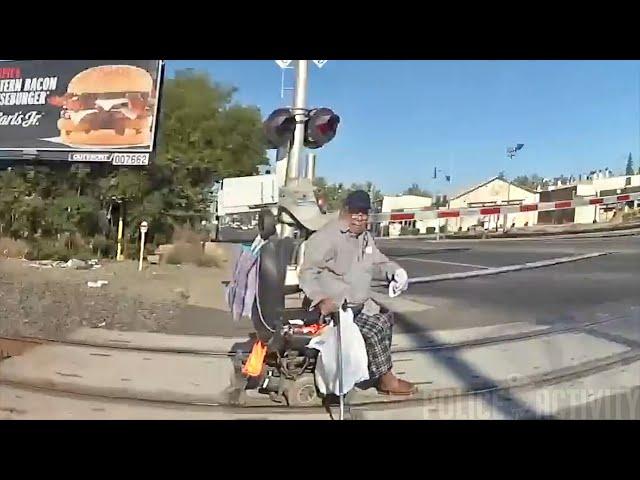 California Officer Saves Man in Wheelchair From Oncoming Train