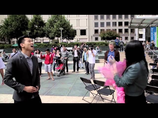 Man propose to his girl friend at San Francisco Union Square during a live band event