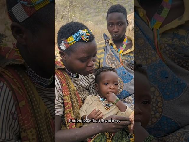 Hadzabe tribe women raise their children in the forest