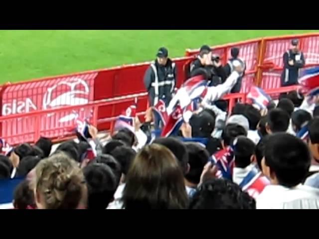 Girl laughing at amusing North Koreans in the Asian Football Cup!