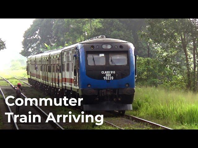 Commuter Train Arriving at Batuwatta Railway Station in Sri Lanka