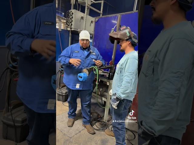 Instructor Victor gives a student a tip for 5G Stainless steel on carbon! 