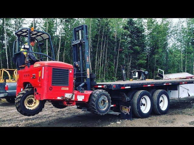 LOADING MOFFETT PIGGYBACK ON FLATBED TRAILER