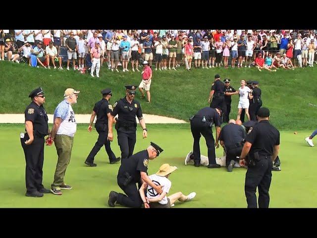 Protesters at Travelers Championship tackled by police after running onto 18th green