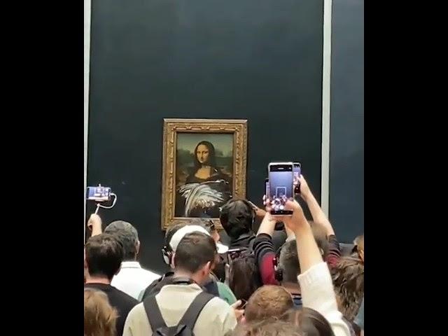 Bizarre incident at the Louvre Museum in Paris - a man in disguise smeared a cake over the Mona Lisa