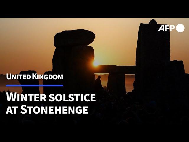 Thousands greet the sun at Stonehenge to celebrate winter solstice | AFP