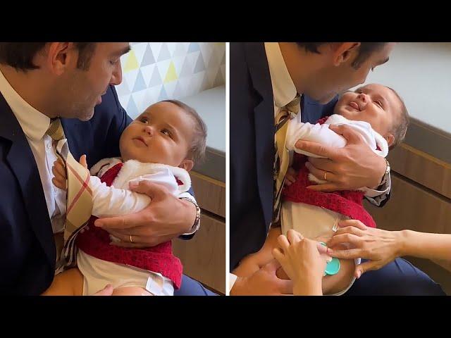 Dad adorably distracts baby during doctor's visit