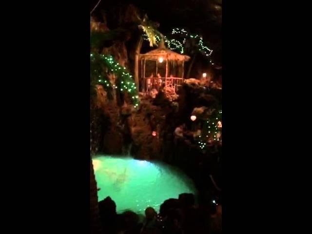 Slow motion back flip into the lagoon at Casa Bonita