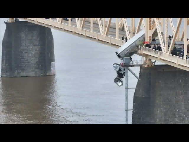 Drone video captures dramatic rescue of woman stuck in semi truck dangling over Louisville bridge