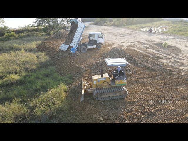 Extremely mini dozer d20 pushing Dirt , Rock with Dump Truck 5ton in action