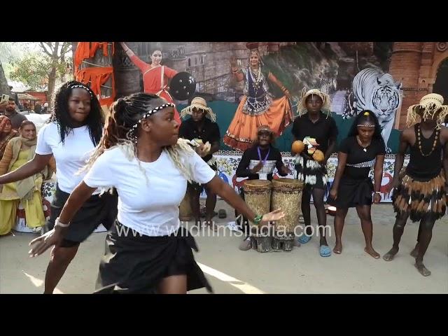 Zimbabwe women dance at Surajkund Crafts Mela in Faridabad Haryana, while men provide percussion