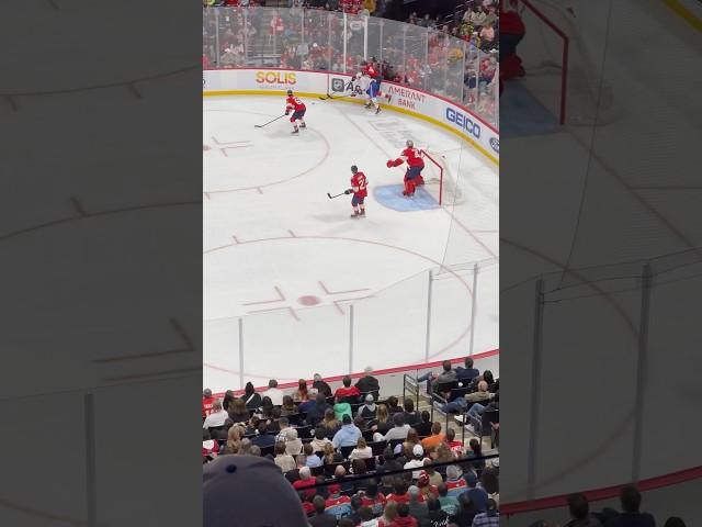 Montreal Canadiens Josh Anderson passes to Sean Monahan who shoots, Jake Evans buzzing the goalie