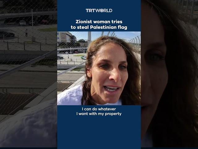 Zionist woman attempts to steal Palestinian flag from protesters