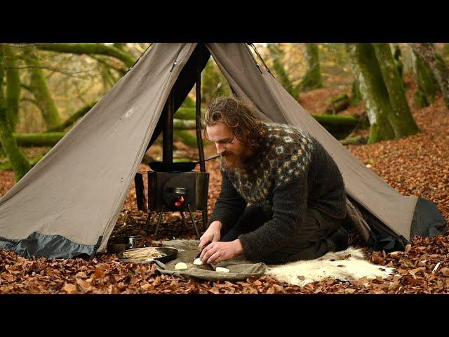 Bushcraft trip - windy day in a canvas tent, cooking on a wood stove, homemade axe and knife etc.