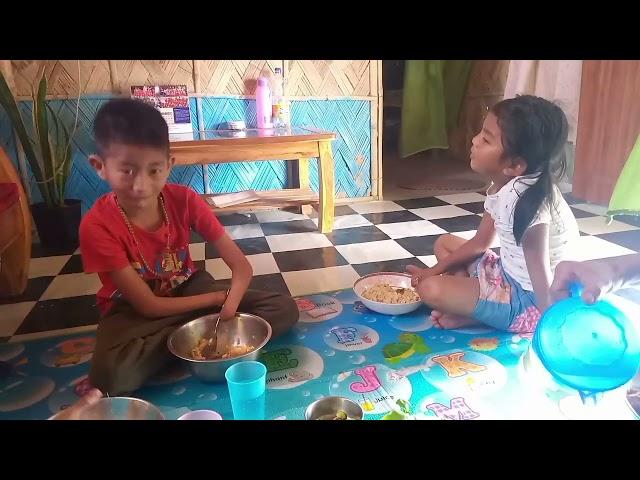 Immanuel and nzanbeni having their dinner together