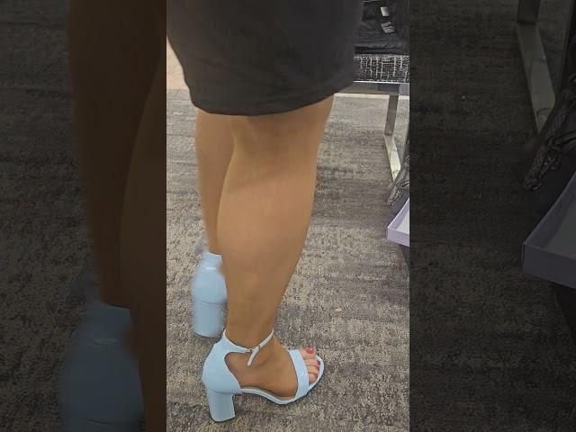 Shoe shopping for baby blue strappy heels with hosiery