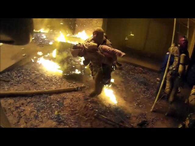 Helmet camera shows firefighter catching child thrown from burning apartment