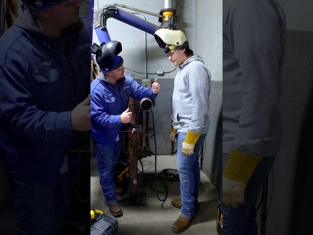 Tommy helps a student with their positioning on 5G pipe! 
